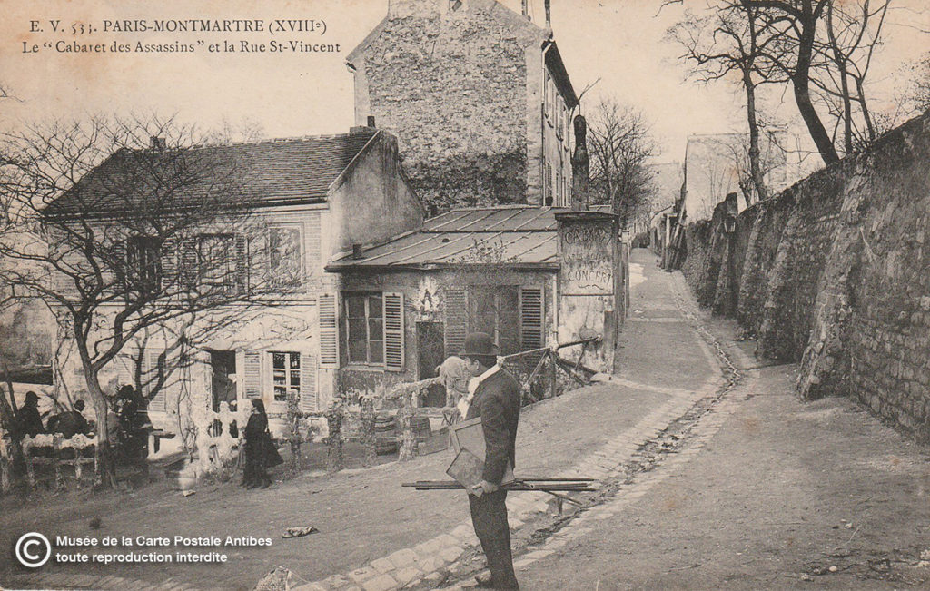 Carte postale ancienne représentant un peintre paysagiste à Paris Montmartre au cabaret des Assassins et sur la Rue St-Vincent.